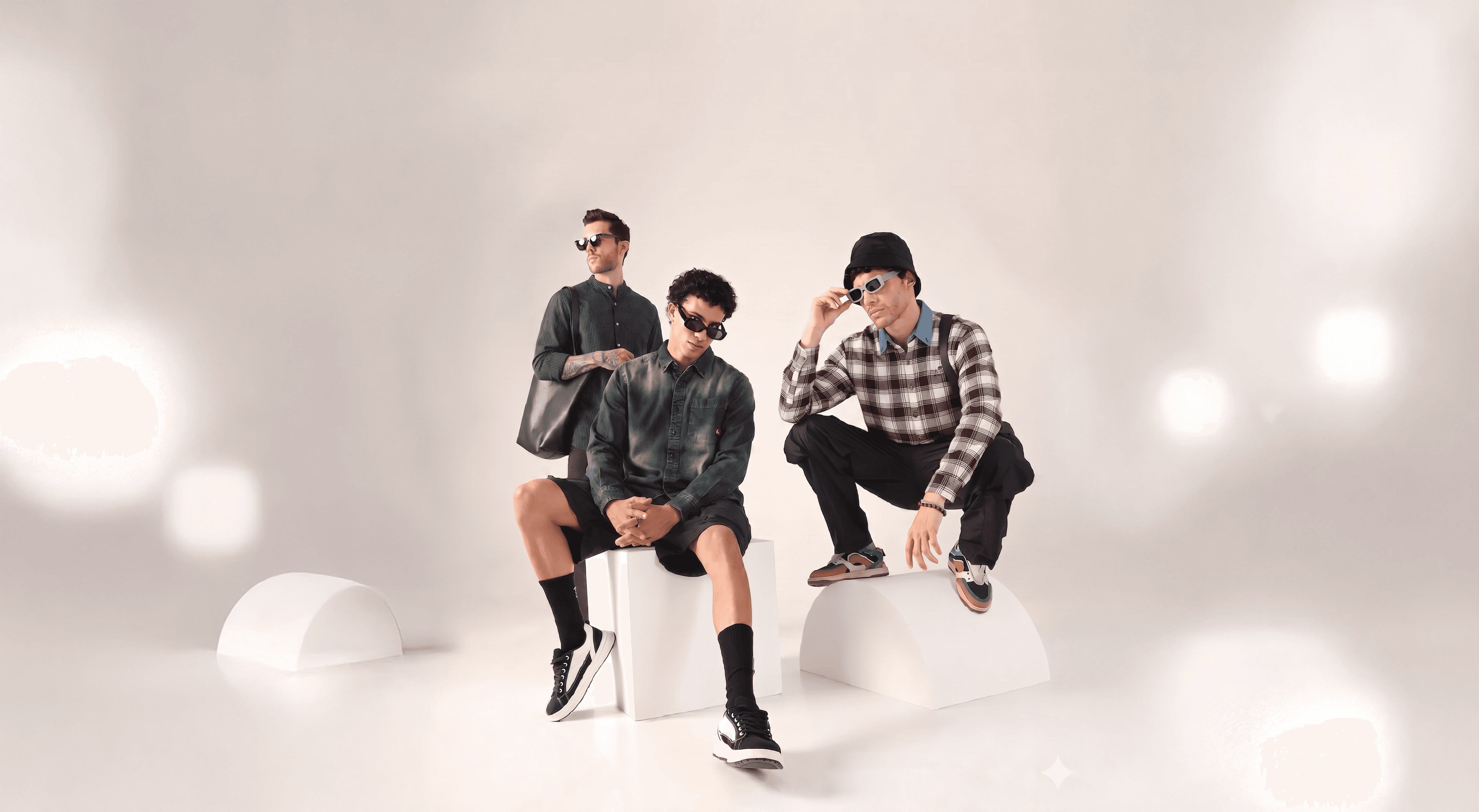 Three models wearing Kevento shirts in a studio setting